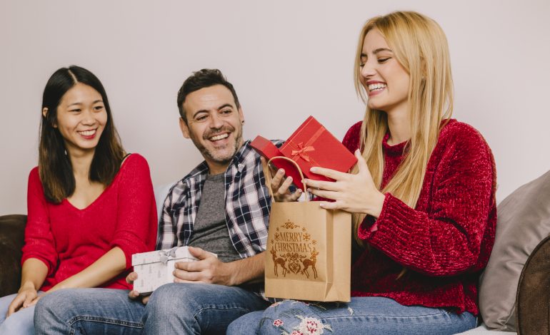 Three friends exchanging Personalized Gifts for Family.